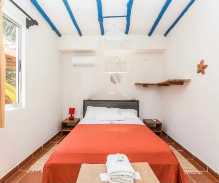 Private bedroom with natural light at BBQ Villa, comfortable retreat accommodation at Casa Sollevante in Montezuma.