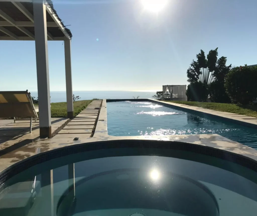 Infinity pool overlooking the Pacific Ocean at Casa Sollevante, the home of Devaya Yoga retreats in Montezuma, Costa Rica.