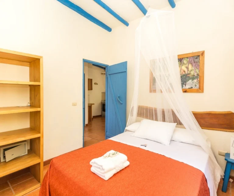 Casita standard bedroom with two beds at Casas Sollevante Costa Rica – clean and airy lodging for yoga retreat participants