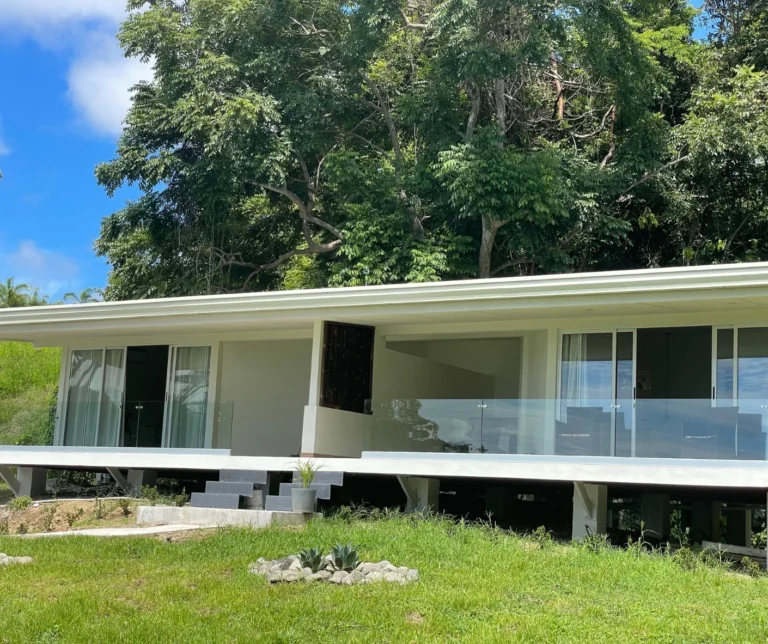 Deluxe room exterior at Casa Sollevante with ocean-view terrace surrounded by tropical nature in Montezuma Costa Rica.
