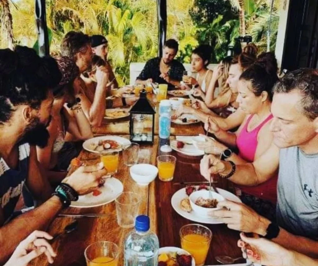 Group enjoying nourishing meals at Devaya Yoga retreats in Montezuma, Costa Rica — community and wellness focus.