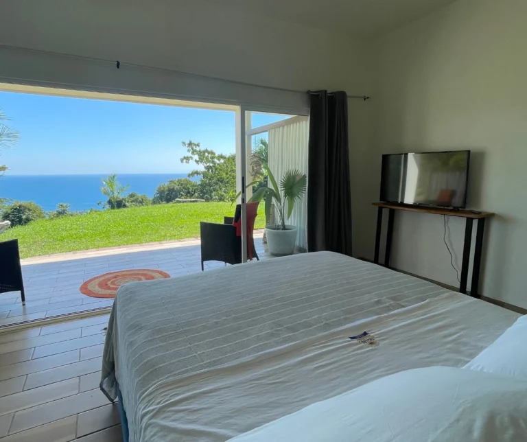 Stunning ocean-view terrace from the Junior Suite at Casas Sollevante, offering serene accommodation for yoga and healing retreats.